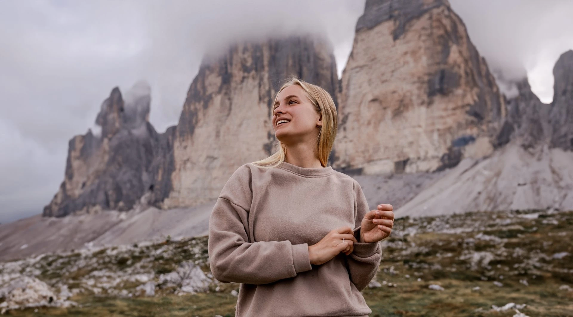 young woman in front of mountains